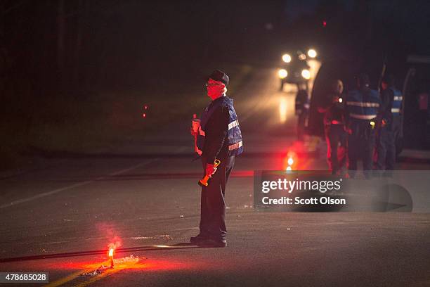 Department of Correction officers man a roadblock near the scene where escaped convict Richard Matt was shot and killed by law enforcement officers...