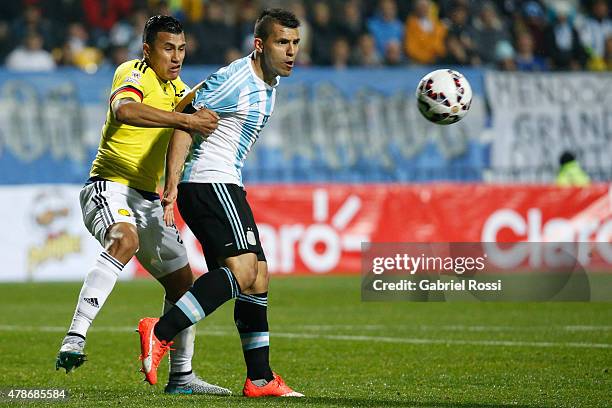 Sergio Aguero of Argentina fights for the ball with Jeison Murillo of Colombia during the 2015 Copa America Chile quarter final match between...