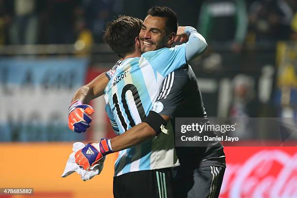 Lionel Messi of Argentina hugs his teammate Sergio Romero after the 2015 Copa America Chile quarter final match between Argentina and Colombia at...