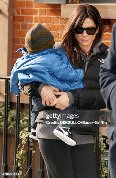 Sandra Bullock is seen carrying her son, Louis Bardo Bullock on January 20, 2011 in New York City.