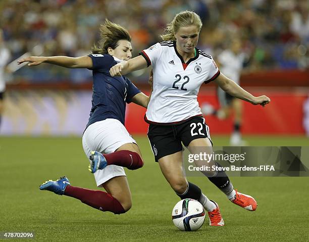 Claire Lavogez of France tackles Tabea Kemme of Germany during during the FIFA Women's World Cup 2015 quarter final match between Germany and France...