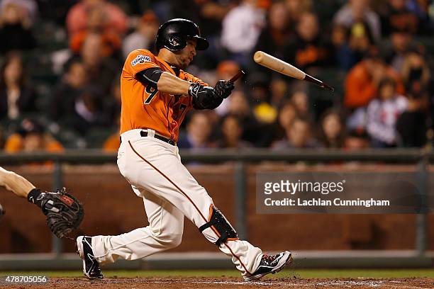 Gregor Blanco of the San Francisco Giants breaks his bat as he hits an RBI single in the ninth inning against the Colorado Rockies at AT&T Park on...