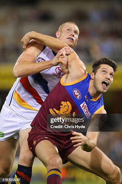 Sam Jacobs of the Crows and Sefan Martin of the Lions compete for the ball during the round 13 AFL match between the Brisbane Lions and the Adelaide...