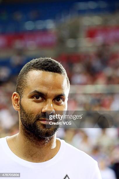 Star Tony Parker plays basketball with fans during his visit in China on June 26, 2015 in Shaoxing, Zhejiang province of China.