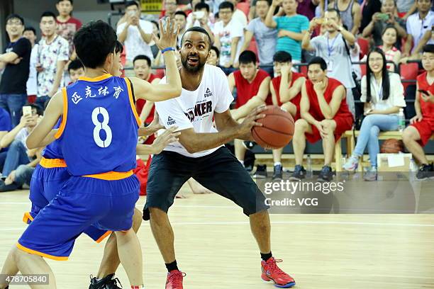 Star Tony Parker plays basketball with fans during his visit in China on June 26, 2015 in Shaoxing, Zhejiang province of China.