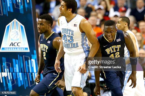 James Michael McAdoo of the North Carolina Tar Heels watches as Talib Zanna of the Pittsburgh Panthers celebrates after a basket during the...