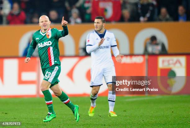 Tobias Werner of Augsburg celebrates his opening goal during the Bundesliga match between FC Augsburg and FC Schalke 04 at SGL Arena on March 14,...