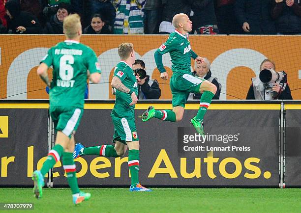 Tobias Werner of Augsburg celebrates his opening goal during the Bundesliga match between FC Augsburg and FC Schalke 04 at SGL Arena on March 14,...
