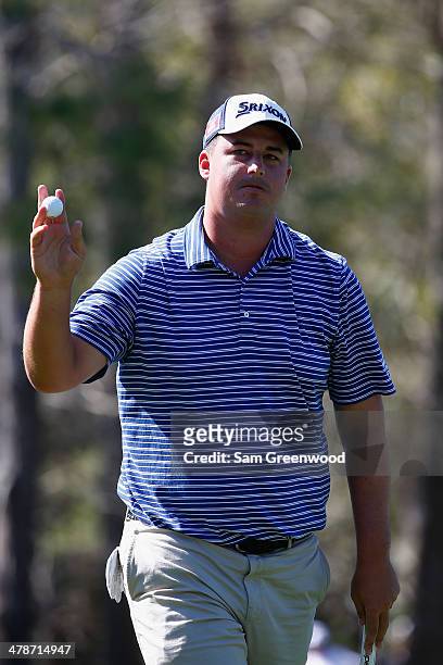 Michael Putnam acknowledges the gallery on the 15th green during the second round of the Valspar Championship at Innisbrook Resort and Golf Club on...