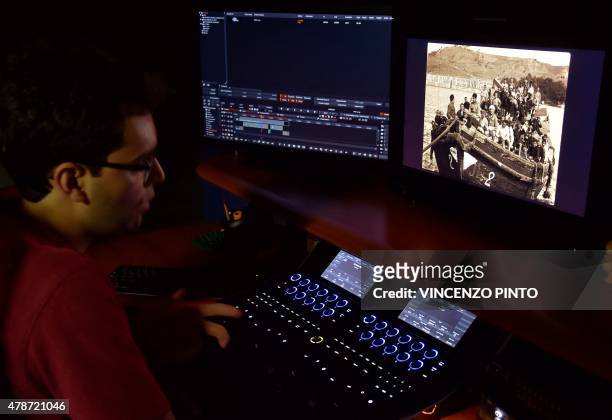 An employee of film restoration laboratory Cineteca di Bologna, works on the restoration of a film about the Armenian genocide entitled "Armenia,...