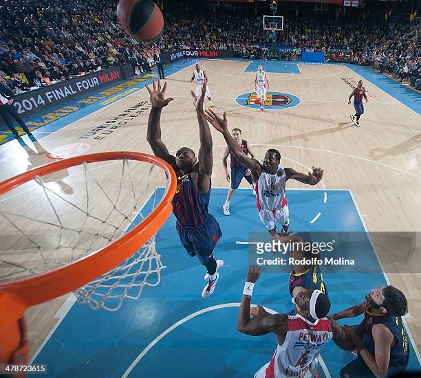 Joey Dorsey, #6 of FC Barcelona competes with Bryant Dunston, #6 of Olympiacos Piraeus during the 2013-2014 Turkish Airlines Euroleague Top 16 Date...