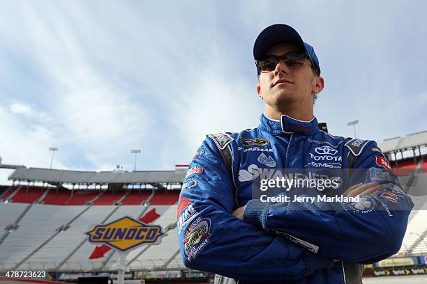 Parker Kligerman, driver of the Swan Energy Toyota, stands on the grid during qualifying for the NASCAR Sprint Cup Series Food City 500 at Bristol...