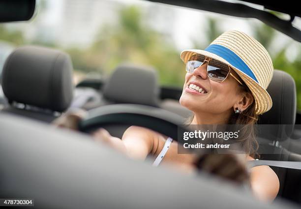 woman on holidays driving a car - car sunshade stock pictures, royalty-free photos & images