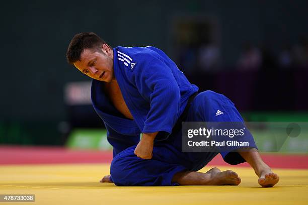 Benjamin Fletcher of Great Britain looks dejected after defeat to Henk Grol of the Netherlands in the Men's Judo -100kg round of 16 contest on day...