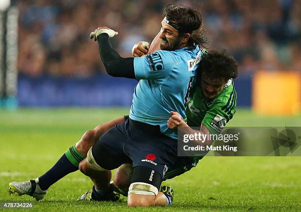 Jacques Potgieter of the Waratahs is tackled during the Super Rugby Semi Final match between the Waratahs and the Highlanders at Allianz Stadium on...