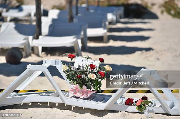 Flowers are placed at the beach next to the Imperial Marhaba Hotel where 38 people were killed yesterday in a terrorist attack on June 27, 2015 in...