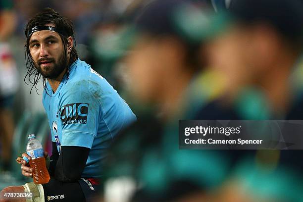 Jacques Potgieter of the Waratahs sits on the sideline after receiving a yellow card during the Super Rugby Semi Final match between the Waratahs and...