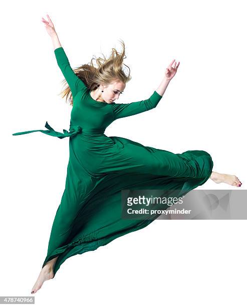 the dancer in midair isolated on white - green dress 個照片及圖片檔