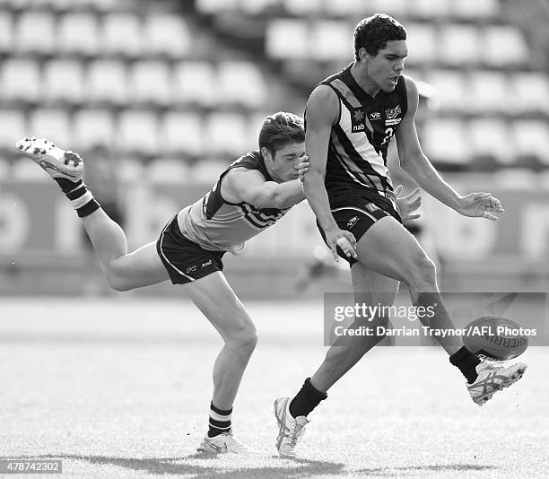 Lachlan Tiziani of NSW/ACT chases Jamie Hampton of Northern Territory during the U18 Championships match between NSW/ACT and Northern Territory at...