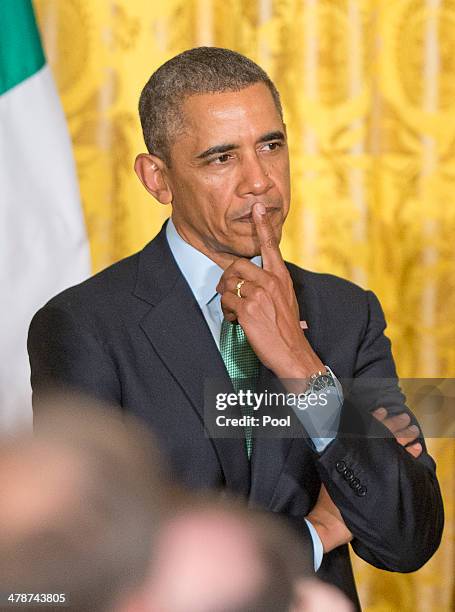 President Barack Obama hosts a St. Patrick's Day reception for Prime Minister Enda Kenny of Ireland and his wife Fionnuala O'Kelly in the East Room...