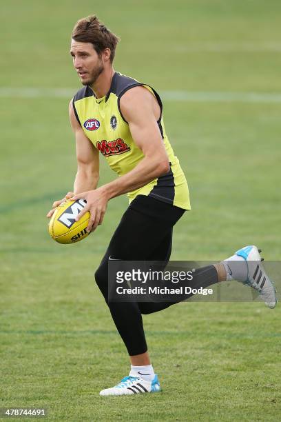 Dale Thomas runs with the ball during a Carlton Blues AFL training session at Visy Park on March 15, 2014 in Melbourne, Australia.