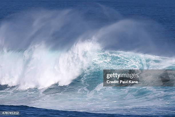 Surfer rides a wave at Surfers Point on June 27, 2015 in Margaret River, Australia. Monster swells were predicted for the south west coast across...