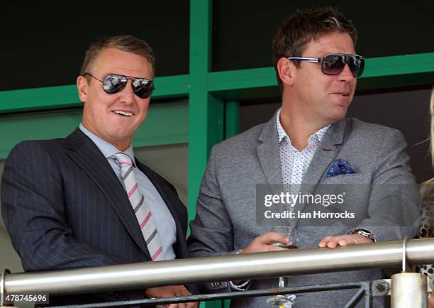 Former footballers Lee Clark and Alan Thompson watch the racing during The Northumberland Plate Meeting at High Gosforth Park on June 27, 2015 in...