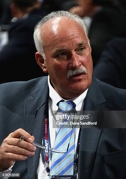 President of Hockey Operations John Davidson of the Columbus Blue Jackets looks on from the draft table during the 2015 NHL Draft at BB&T Center on...