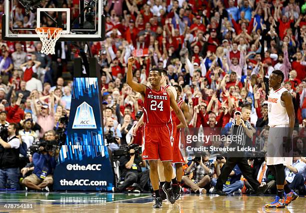 Warren of the North Carolina State Wolfpack celebrates after defeating the Syracuse Orange 66-63 during the quarterfinals of the 2014 Men's ACC...