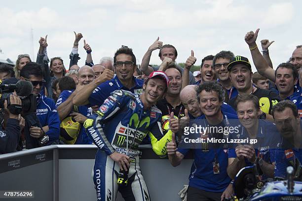 Valentino Rossi of Italy and Movistar Yamaha MotoGP celebrates the victory under the podium with team at the end of the MotoGP race during the MotoGP...