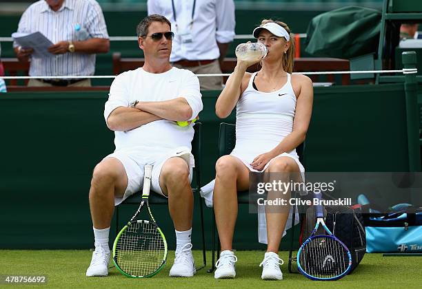 Maria Sharapova of Russia with her coach Sven Groeneveld during a practice session prior to the Wimbledon Lawn Tennis Championships at the All...