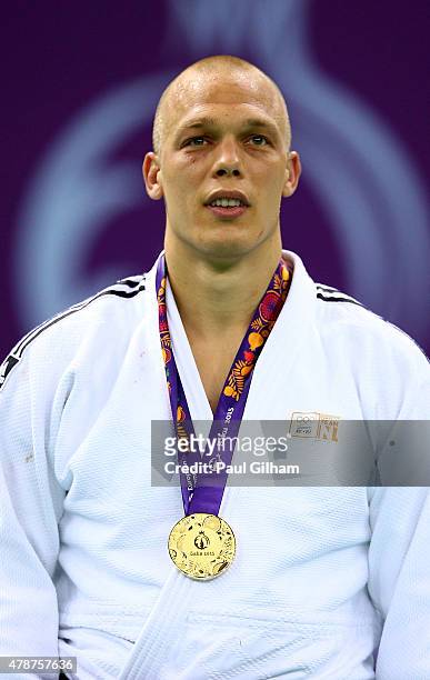 Gold medalist Henk Grol of the Netherlands stands on the podium during the medal ceremony for the Men's Judo -100kg during day fifteen of the Baku...