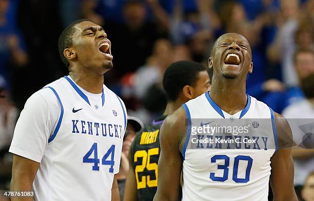 Dakari Johnson and Julius Randle of the Kentucky Wildcats react after Randle drew a foul against LSU Tigers during the quarterfinals of the SEC Men's...