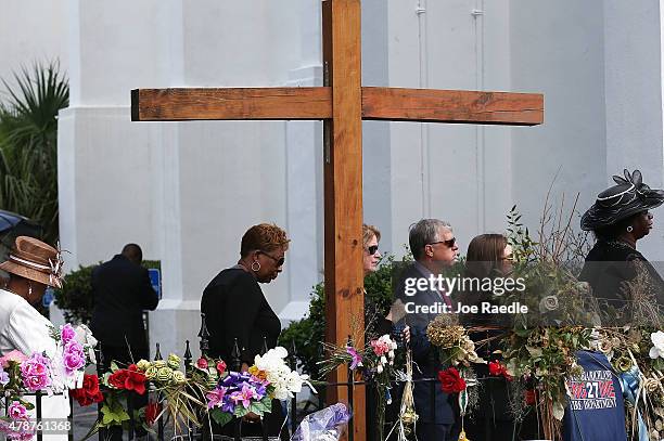 Mourners wait in line to attend the funeral of Cynthia Hurd at the Emanuel African Methodist Episcopal Church where she was killed along with eight...