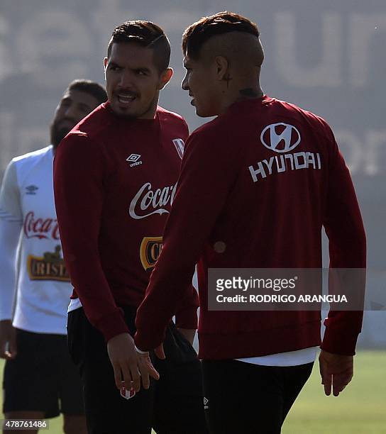 Peru's midfielder Juan Vargas and forward Paolo Guerrero take part in a training session in Santiago on June 27, 2015 during the Copa America...