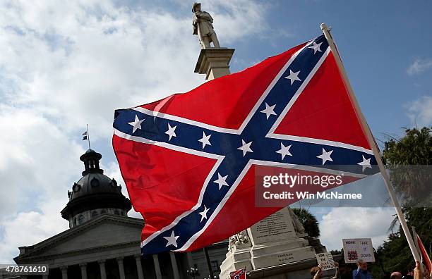 Demonstrators protest at the South Carolina State House calling for the Confederate flag to remain on the State House grounds June 27, 2015 in...