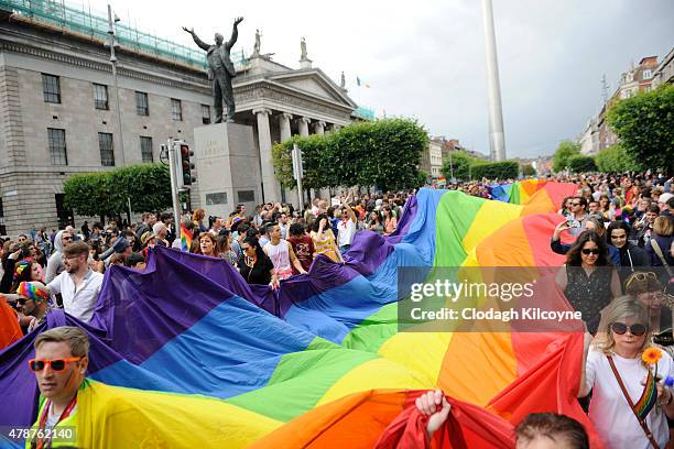 People take part in the annual Gay Pride Parade on June 27, 2015 in Dublin, Ireland. Gay marriage was declared legal across the US in a historic...