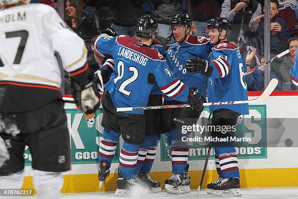 Members of the Colorado Avalanche celebrate a first period goal against the Anaheim Ducks at the Pepsi Center on March 14, 2014 in Denver, Colorado.