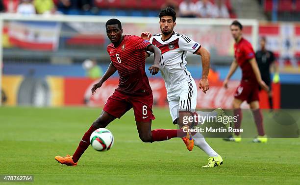 William Carvalho of Portugal and Emre Can of Germany battle for the ball during the UEFA European Under-21 semi final match Between Portugal and...