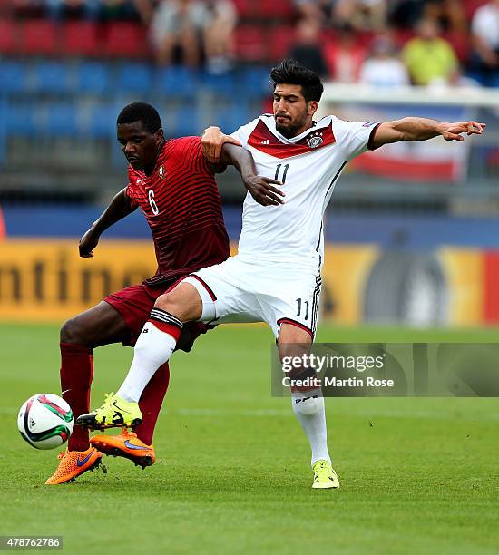 William Carvalho of Portugal and Emre Can of Germany battle for the ball during the UEFA European Under-21 semi final match Between Portugal and...