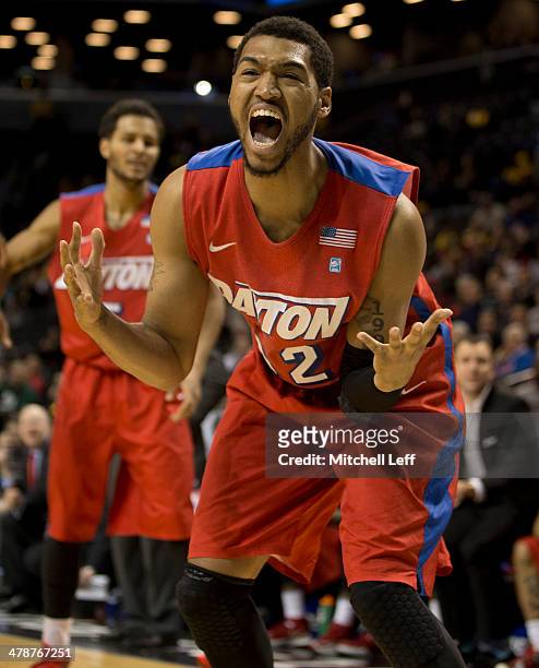 Forward Jalen Robinson of the Dayton Flyers reacts after letting the ball go out of bounds in the game against the Saint Joseph's Hawks in the...