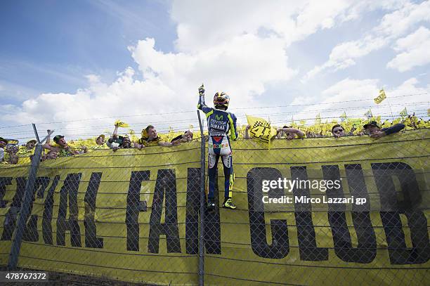 Valentino Rossi of Italy and Movistar Yamaha MotoGP celebrates the victory in front of fans at the end of the MotoGP race during the MotoGP...