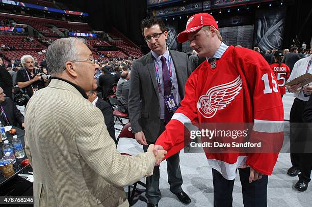 Jim Devellano of the Detroit Red Wings shakes hands with Adam Marsh, 200th overall pick by the Detroit Red Wings, during the 2015 NHL Draft at BB&T...