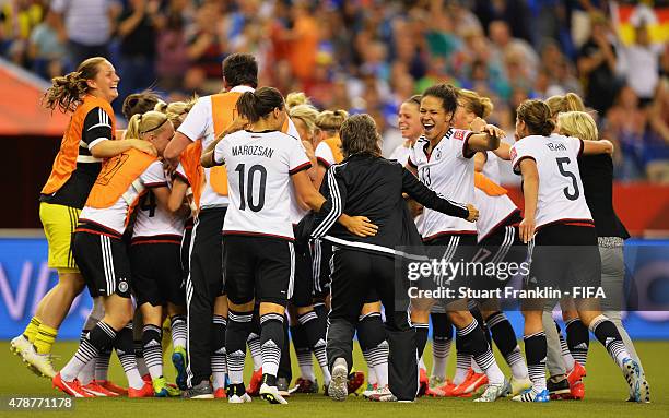 Players of Germany celebrate at the end of the quarter final match of the FIFA Women's World Cup between Germany and France at Olympic Stadium on...