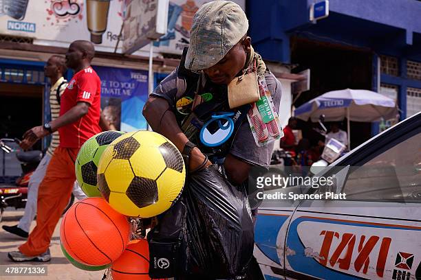 Street vendor sells goods on June 27, 2015 in Bujumbura, Burundi. Burundi is one of the worlds poorest countries with food shortages throughout the...