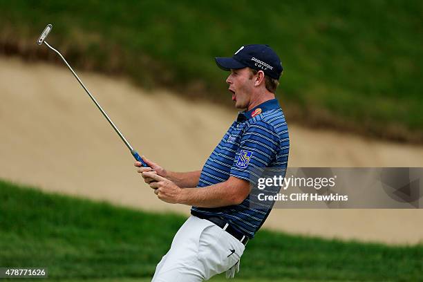 Brandt Snedeker reacts to a missed putt on the 18th green during the third round of the Travelers Championship at TPC River Highlands on June 27,...