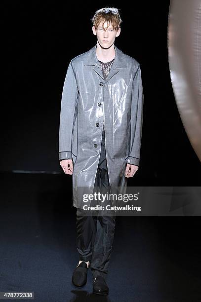 Model walks the runway at the Wooyoungmi Spring Summer 2016 fashion show during Paris Menswear Fashion Week on June 27, 2015 in Paris, France.