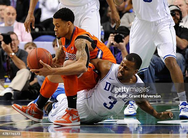 McDaniels of the Clemson Tigers battles for a loose ball with Tyler Thornton of the Duke Blue Devils during the quarterfinals of the 2014 Men's ACC...