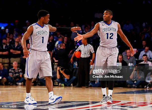 Austin Chatman and Jahenns Manigat of the Creighton Bluejays celebrate in the second half against the Xavier Musketeers during the Semifinals of the...