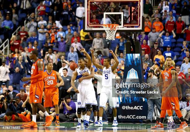 Teammates Tyler Thornton, Rasheed Sulaimon and Rodney Hood of the Duke Blue Devils celebrate after defeating the Clemson Tigers 63-62 during the...